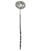 A toddy ladle with inset George III silver shilling.
