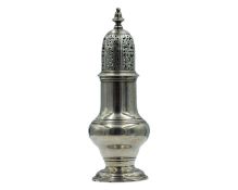 A silver George II muffineer by Samuel Wood.