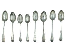 A selection of George III and later silver Old-English pattern teaspoons.