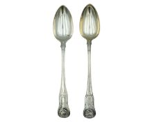 Two George III silver fiddle thread and shell serving spoons.