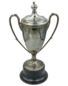 A George V silver lidded twin-handled trophy.