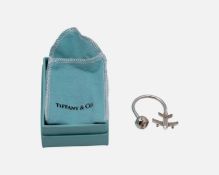 TIFFANY & CO - A 925 silver keyring, in the form of a globe and aeroplane, with box and pouch.