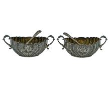 A pair of Victorian silver condiment pots by the Atkin Brothers.