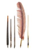 Two modern silver dip pens.