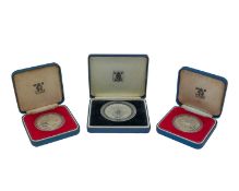 Three QEII Royal Commemorative .925 silver proof crown coins, cased with certificates.