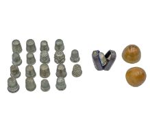 A selection of seventeen silver thimbles.