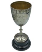 A silver trophy cup by James Deakin & Sons.