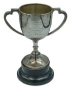 A two-handled silver trophy by S Blanckensee & Son Ltd.