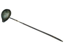 A Georgian-style silver toddy ladle.