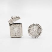 An Edwardian silver vesta case, and a Victorian silver brooch.