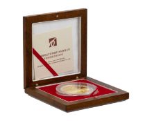 A Chinese Shanghai Mint .999 fine silver and gold-plated 100g medallion. For the 10-year anniversary