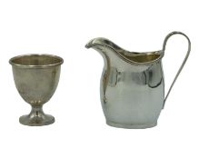 A silver cream jug by George Nathan & Ridley Hayes.