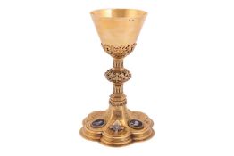 A mid to late 19th century Austro-Hungarian silver gilt chalice, the tapering cylindrical bowl suppo
