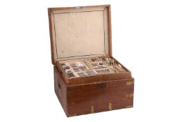 A George III matched silver canteen in fitted case, fiddle pattern, with various dates and makers, a