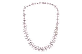 A diamond-set necklace of abstract foliate design, comprising a series of graduating round brilliant