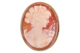 A shell cameo brooch cum pendant, depicting the bust of a lady, to a 9ct yellow gold frame with wove