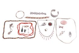 A group of jewellery, to include a white metal open bangle with chevron detail, 3.0cm wide; a tiger'