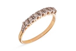 A diamond-set half hoop ring, claw-set with seven single-cut diamonds, to a bi-colour metal mount ma