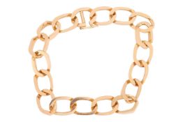 A curb link bracelet, completed with a conforming clasp with safety catch, yellow metal stamped '18c