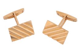 A pair of cufflinks of rectangular form with striated design, the panels fitted with toggle swivels,