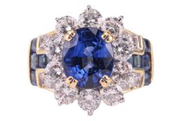 An unheated Burmese sapphire and diamond dress ring, centred with a cushion-cut sapphire of vivid bl