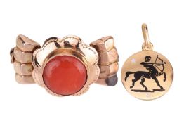 A coral brooch and a sagittarius enamel charm; the brooch collet-set with a round coral cabochon of 