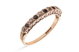 A sapphire and paste-set half-hoop ring, claw-set in an alternating pattern, to a 9ct gold mount, si