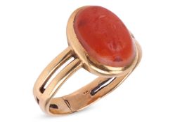 A Roman carnelian intaglio ring, the oval cabochon with engravings depicting Mercury, caduceus in on