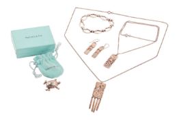A small group of jewellery items comprising a Tiffany & Co turtle brooch in white metal marked ‘