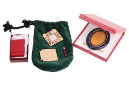 A small group of items comprising a Must de Cartier blue enamel picture frame in a branded box, an A