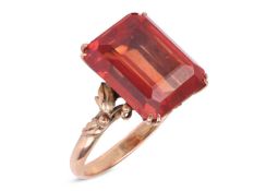A synthetic orange sapphire ring, with an emerald-cut synthetic sapphire in reddish-orange colour, d