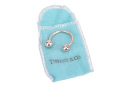 Tiffany & Co. - a bull keyring, open hoop with screw-in ball terminations, signed and stamped '9
