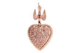A heart-shaped pendant with diamonds, comprises a hollow heart pendant in yellow precious metal, ful
