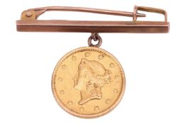 An 1853 United States of America one dollar gold coin, Liberty head to the left, suspended from a ba