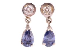 A pair of paste and diamond drop earrings, each claw-set with a purple pear-cut paste, with single-c