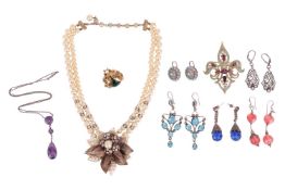 A collection of costume jewellery, comprising a faux pearl necklace with large floral pendant; a gem