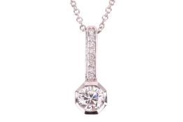 A diamond-set pendant, composed of a round brilliant diamond measuring approximately 5.4mm, with an 