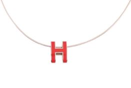 Hermès - A Mini Pop H pendant on chain, the gilt metal pendant with red lacquer, 1.6 x 1.4 cm, on a 