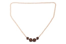 A long cultured pearl necklace with a Modernist centrepiece, comprising four cylinders each set with