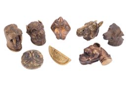 A collection of eight figural vestas, comprising an owl, an orange segment, a bison, a walrus, a box