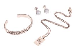 A Gucci ghost skull silver pendant on chain, a Montblanc open bangle, and a pair of cufflinks; the s