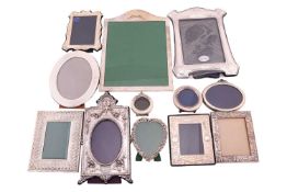 A large 20th-century Asprey & Co Neo Classical silver fronted easel photograph frame with tied r