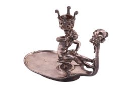 Joseph Cheret. A pewter chamberstick, with figural mask carrying handle and oval-shaped dish, the no