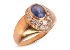 A sapphire and diamond dress ring, the egg-shaped ring head collet-set with an oval-cut sapphire of 