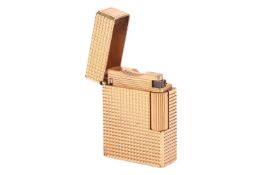 An S.T. Dupont gold-plated lighter with cross-hatched patterns, cover with vacant square catouche, s