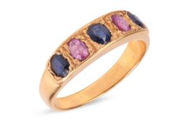 A five-stone sapphire ring, comprising three grain-set blue oval-cut sapphires interspersed with two