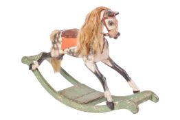 An early 20th-century small child's wooden rocking horse, of typical form, dapple grey, on a painted