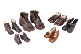 A pair of late Victorian child's boots, brown leather with iron fittings to the soles, 18 cm wide, t