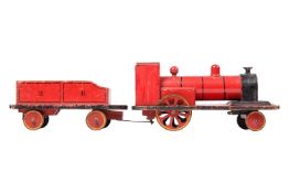 A large vintage scratch built wooden toy pull-along steam engine and tender, early 20th century, red
