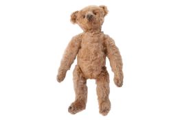 An early 20th century Steiff mohair bear, with black glass eyes, padded and stichced feet and hands,